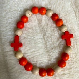 Orange and white cross bead bracelet